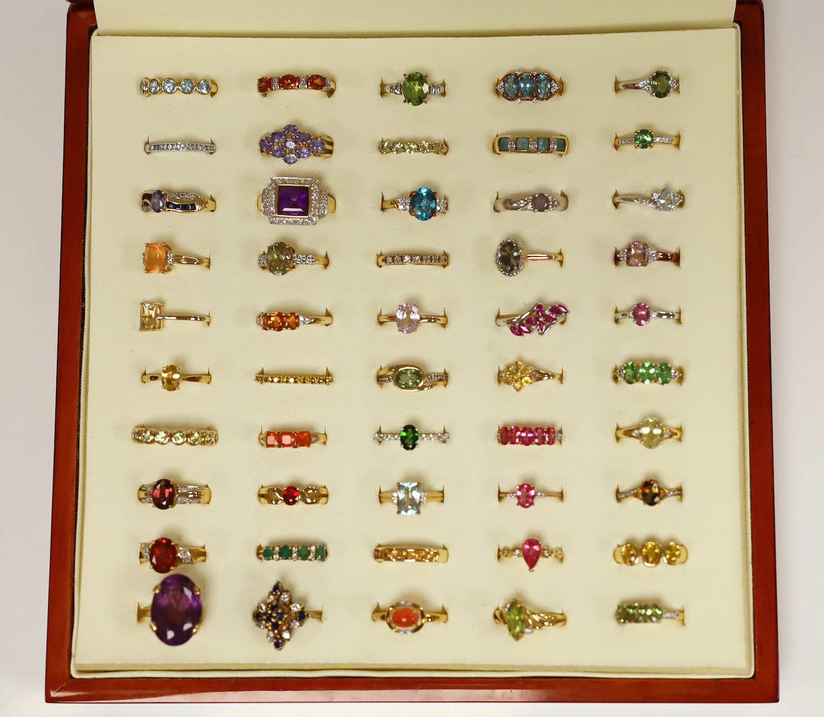 Forty seven assorted modern 9ct gold and gem set dress rings, including amethyst, citrine and garnet, two stamped 10k and one 9k and three 18ct gold and gem set dress rings, in ring box.
